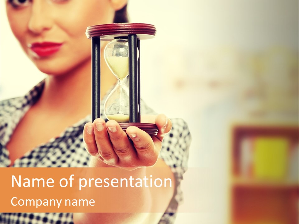 A Woman Holding An Hourglass In Her Hand PowerPoint Template