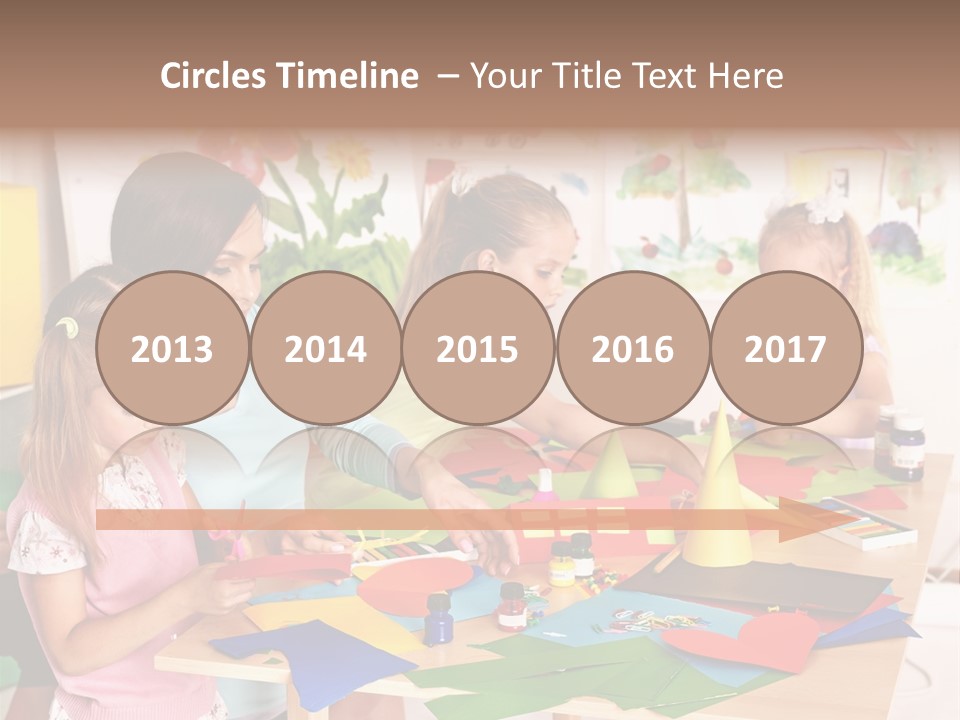 A Group Of Children Sitting Around A Table PowerPoint Template