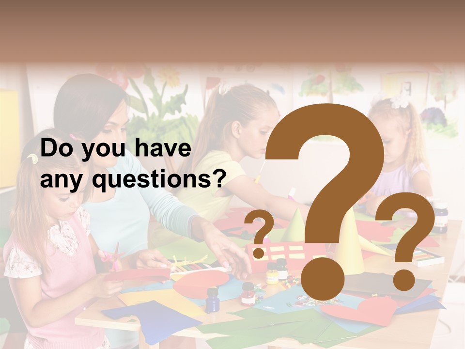 A Group Of Children Sitting Around A Table PowerPoint Template