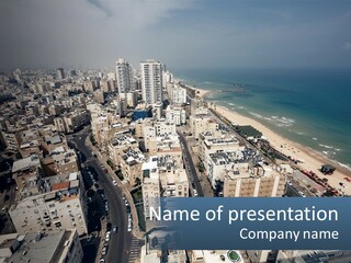 An Aerial View Of A City With The Ocean In The Background PowerPoint Template