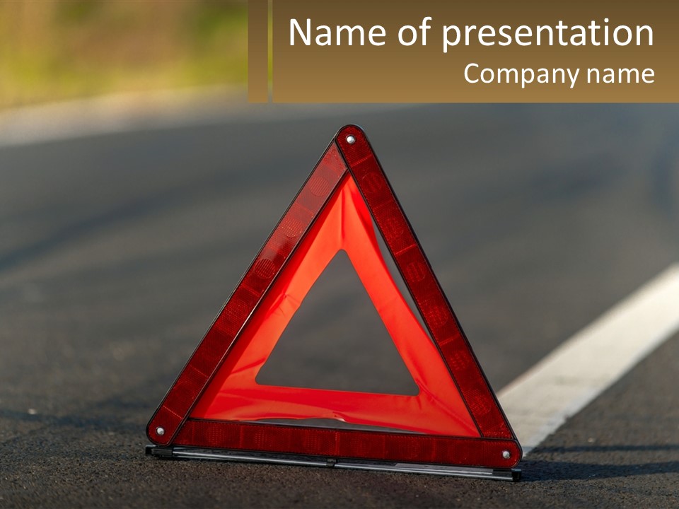 A Red Triangle Sign Sitting On The Side Of A Road PowerPoint Template
