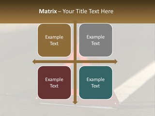 A Red Triangle Sign Sitting On The Side Of A Road PowerPoint Template