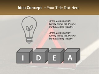 A Red Triangle Sign Sitting On The Side Of A Road PowerPoint Template