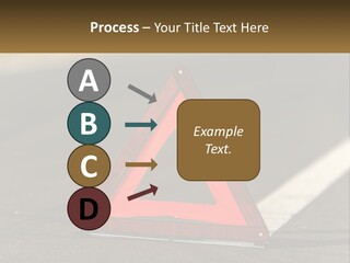 A Red Triangle Sign Sitting On The Side Of A Road PowerPoint Template