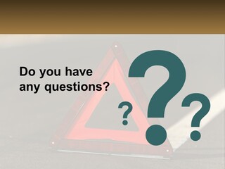 A Red Triangle Sign Sitting On The Side Of A Road PowerPoint Template