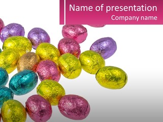 A Pile Of Chocolate Eggs Sitting On Top Of A Table PowerPoint Template