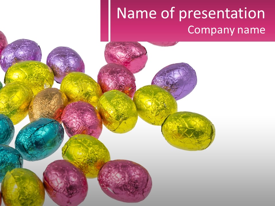 A Pile Of Chocolate Eggs Sitting On Top Of A Table PowerPoint Template