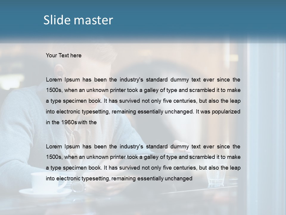 A Man Sitting At A Table Using A Tablet PowerPoint Template