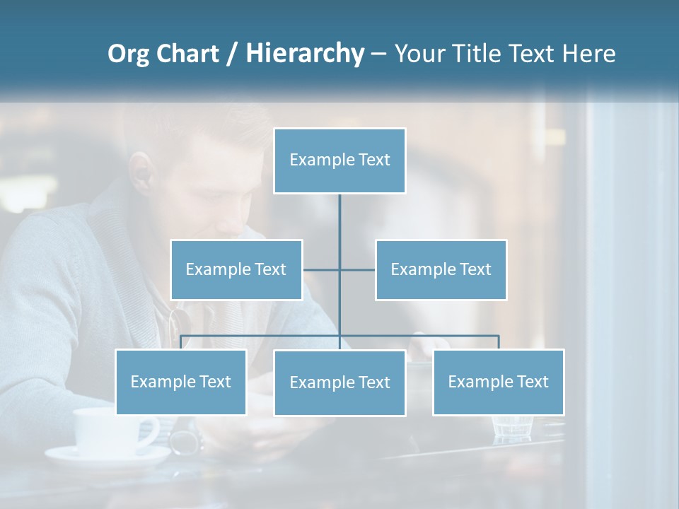 A Man Sitting At A Table Using A Tablet PowerPoint Template