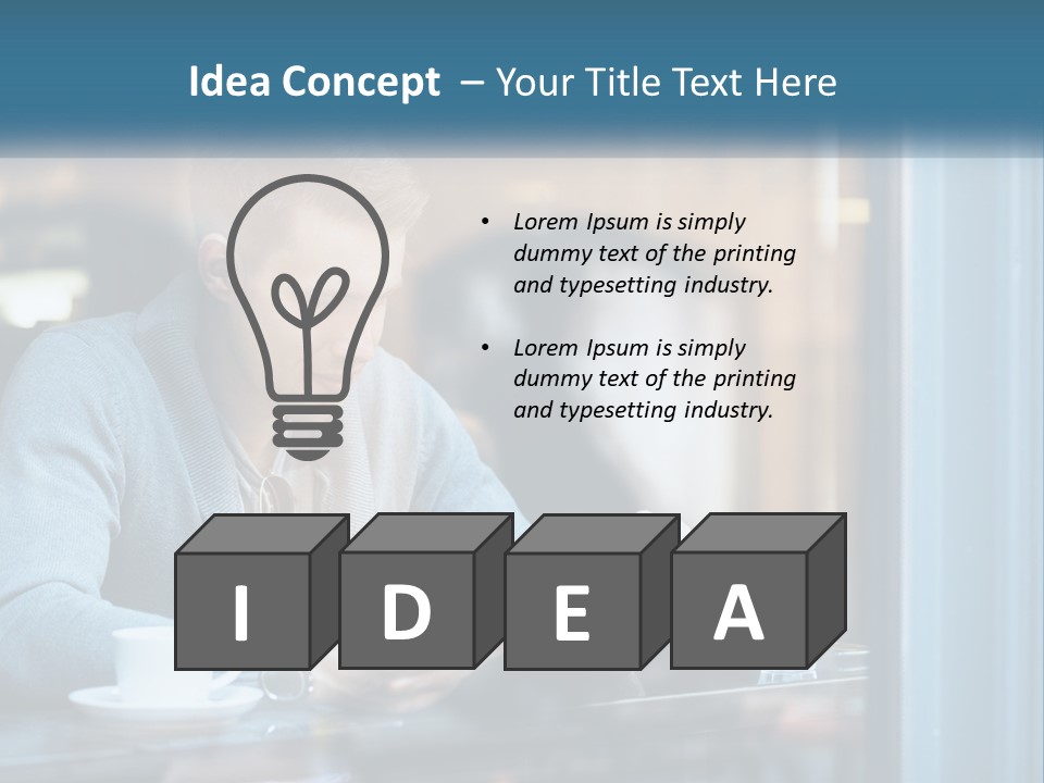 A Man Sitting At A Table Using A Tablet PowerPoint Template