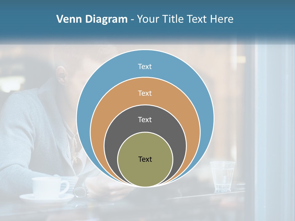 A Man Sitting At A Table Using A Tablet PowerPoint Template