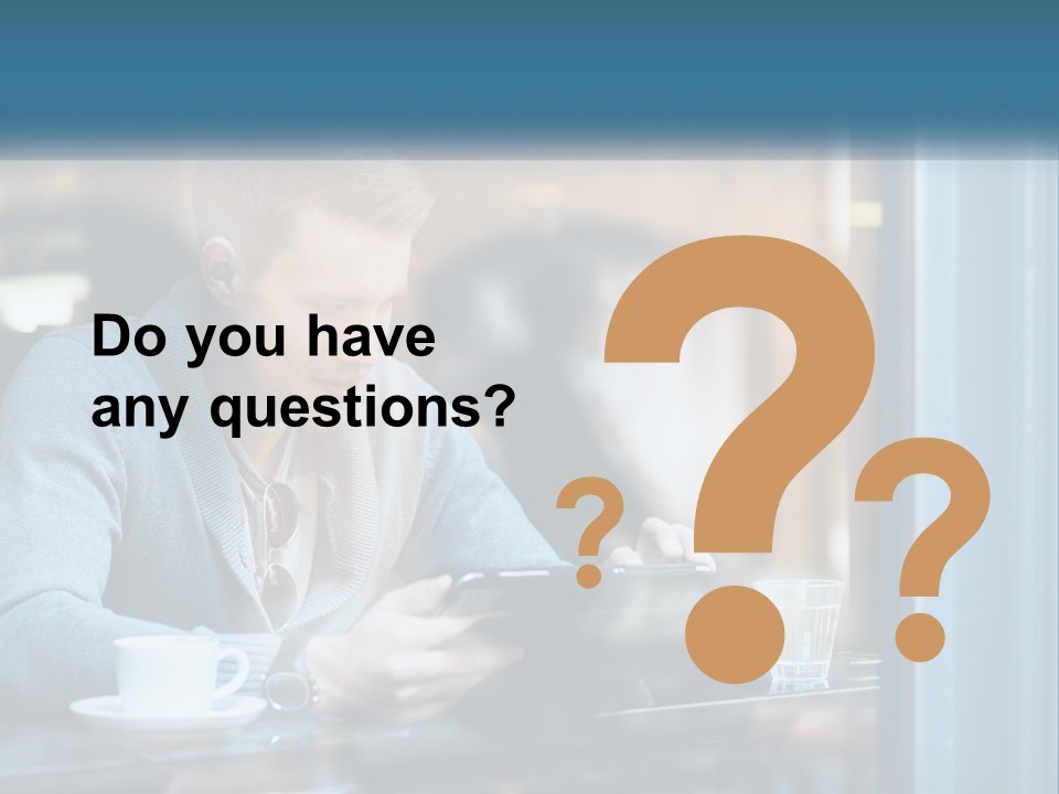 A Man Sitting At A Table Using A Tablet PowerPoint Template