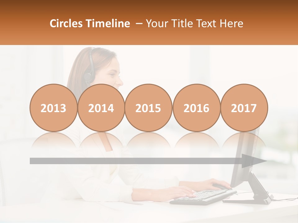 A Woman Wearing A Headset Using A Computer PowerPoint Template