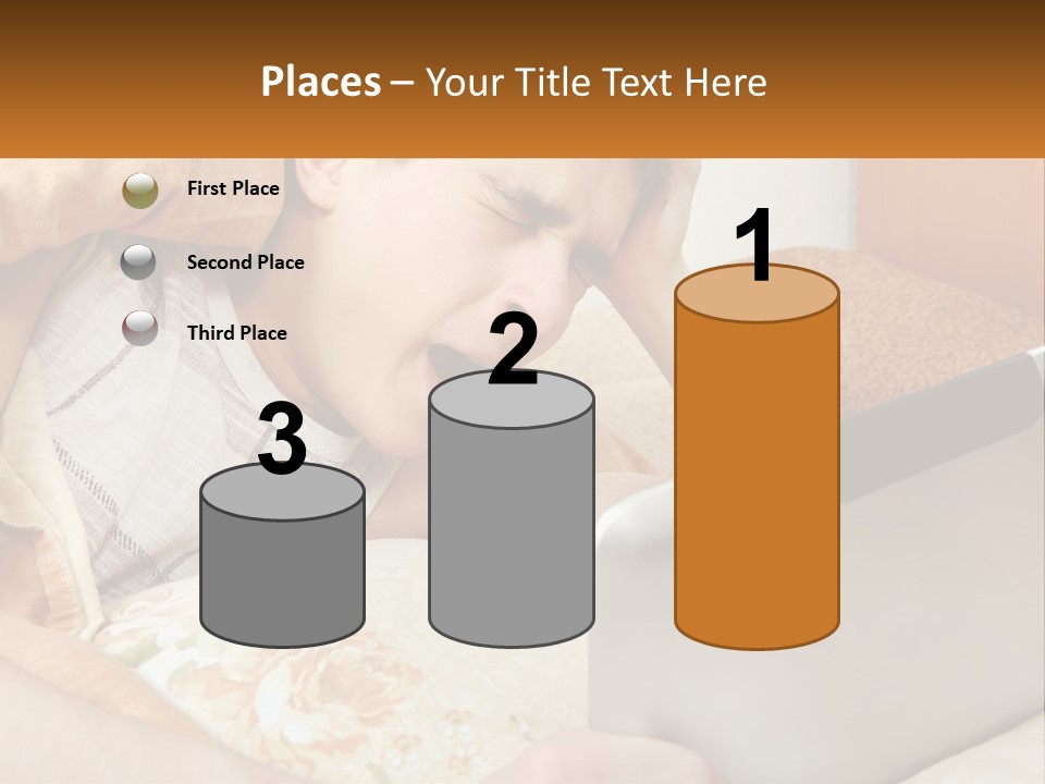 A Young Boy Laying In Bed Using A Laptop Computer PowerPoint Template