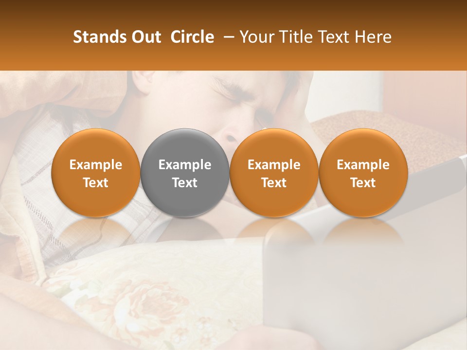 A Young Boy Laying In Bed Using A Laptop Computer PowerPoint Template