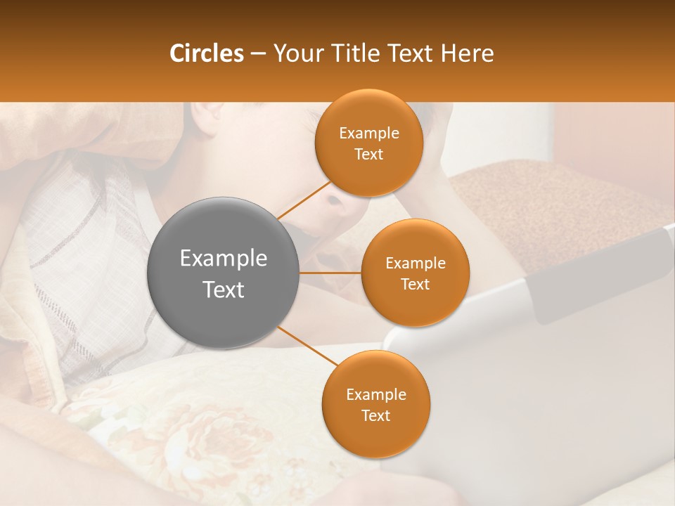 A Young Boy Laying In Bed Using A Laptop Computer PowerPoint Template