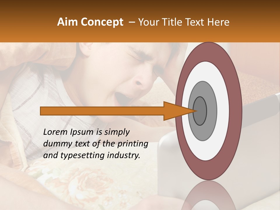 A Young Boy Laying In Bed Using A Laptop Computer PowerPoint Template