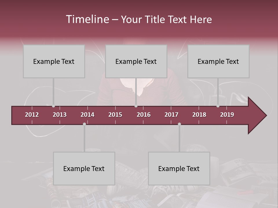 A Woman Sitting In Front Of A Blackboard With A Laptop PowerPoint Template