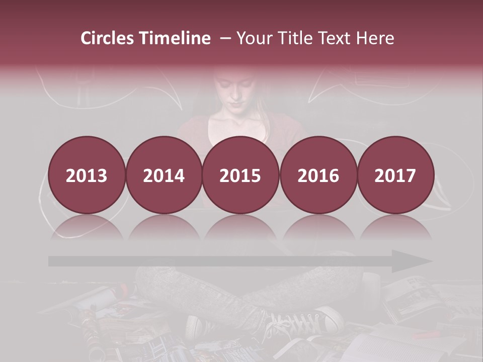 A Woman Sitting In Front Of A Blackboard With A Laptop PowerPoint Template