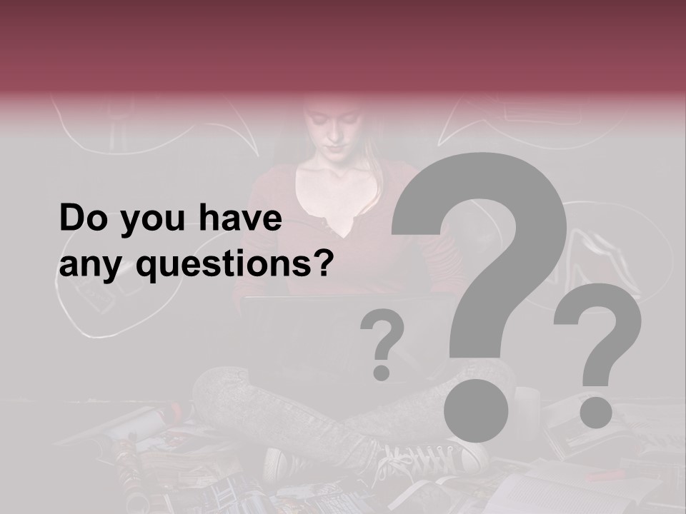 A Woman Sitting In Front Of A Blackboard With A Laptop PowerPoint Template