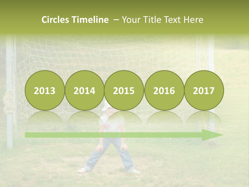 A Young Boy Standing In Front Of A Soccer Goal PowerPoint Template