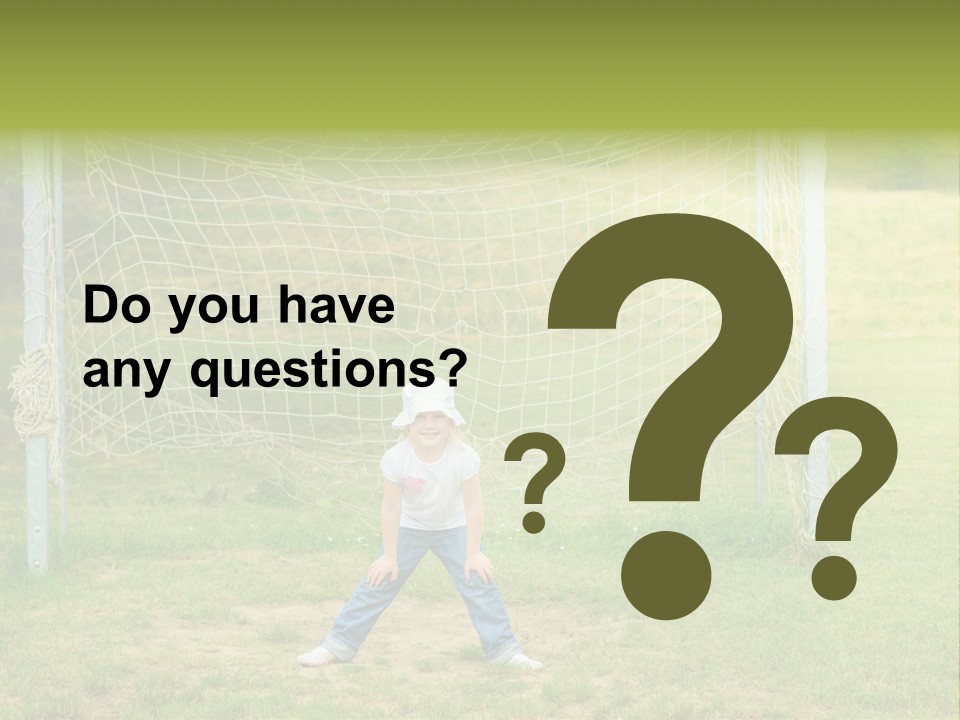 A Young Boy Standing In Front Of A Soccer Goal PowerPoint Template