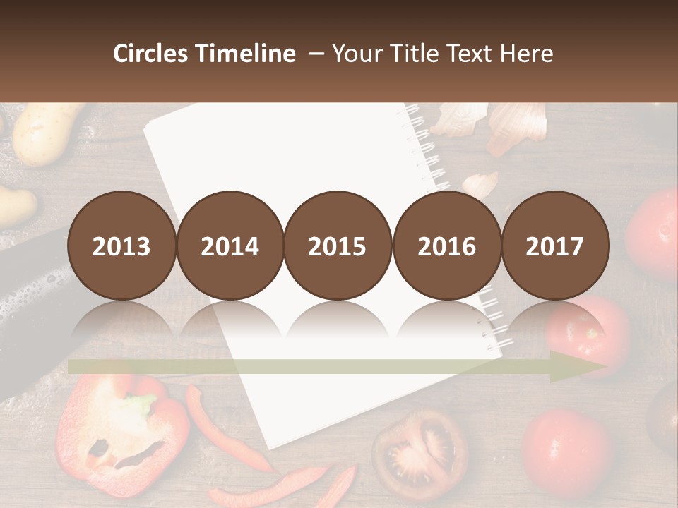 A Table With A Notebook And Vegetables On It PowerPoint Template