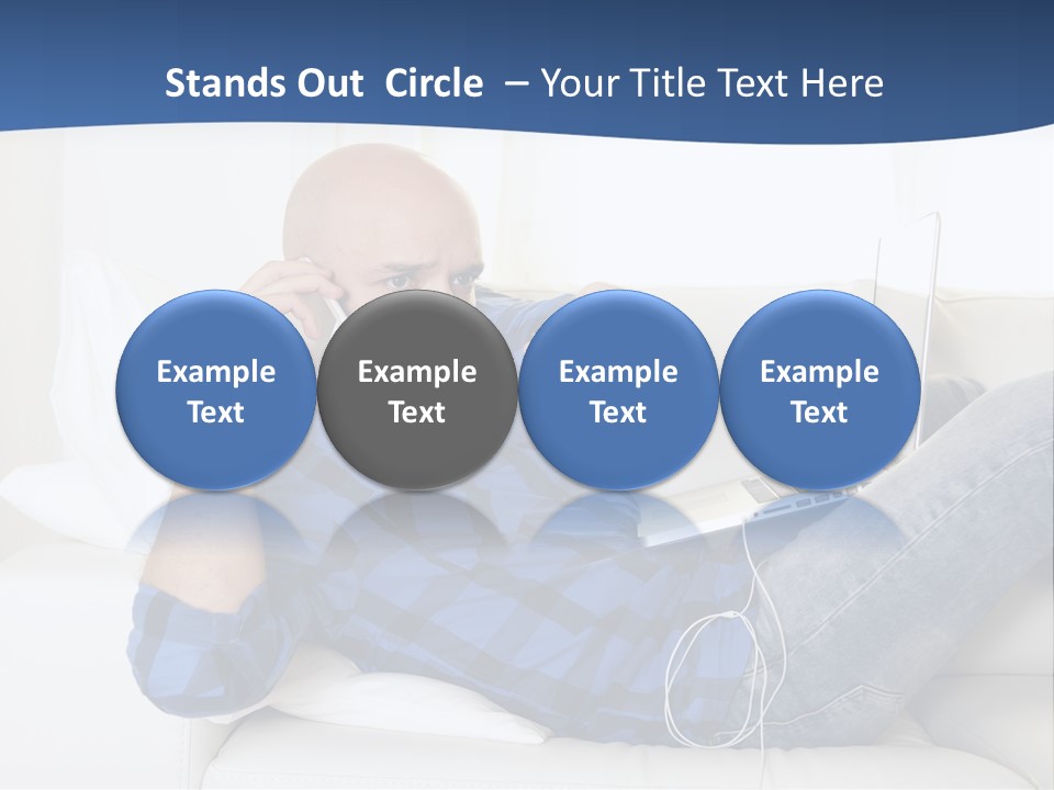 A Man Sitting On A Couch Talking On A Cell Phone PowerPoint Template