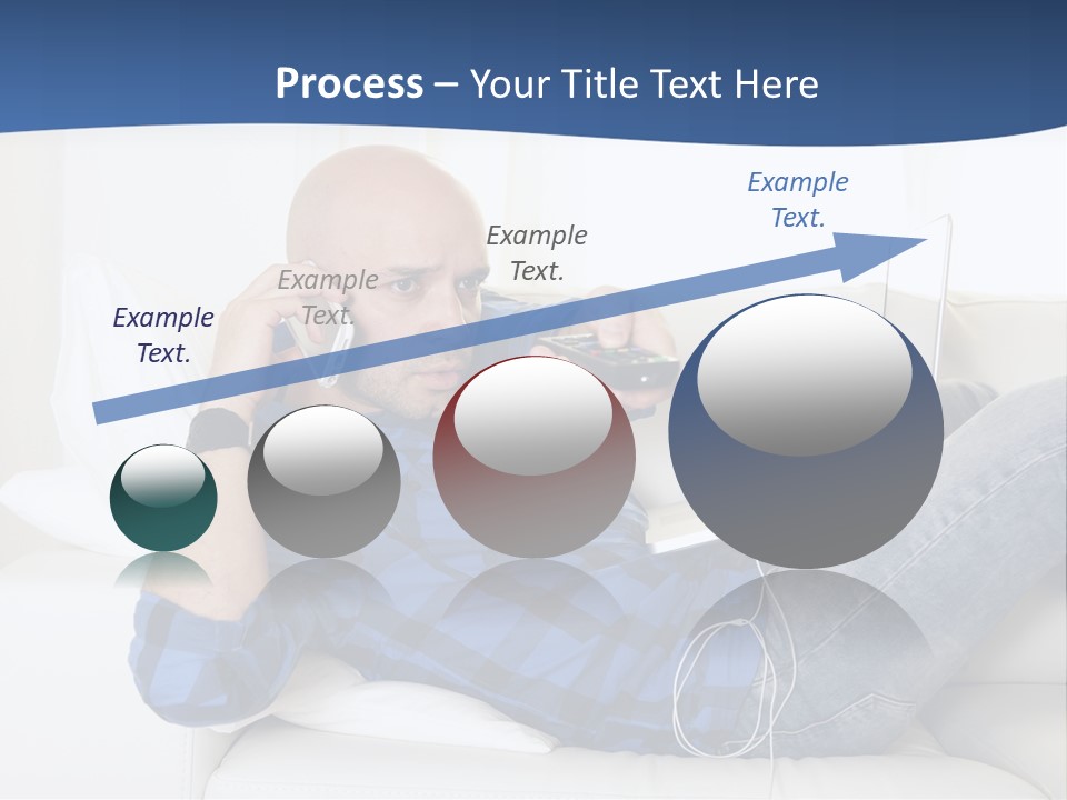 A Man Sitting On A Couch Talking On A Cell Phone PowerPoint Template
