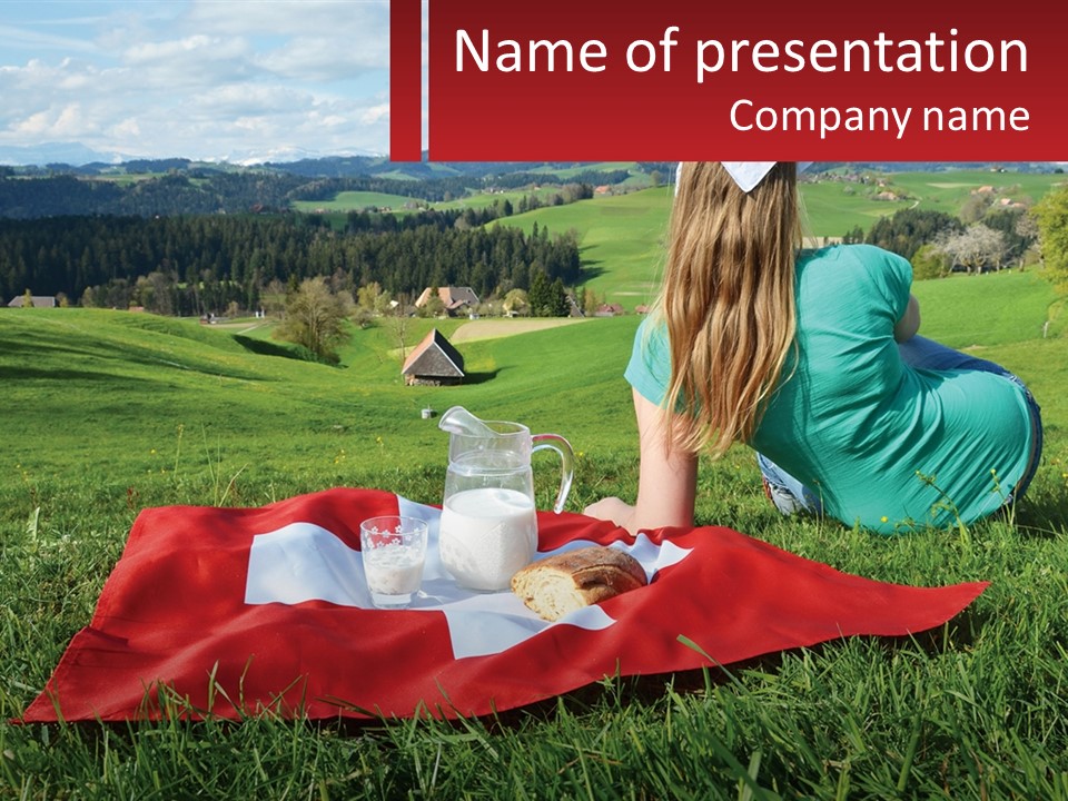 A Woman Sitting On Top Of A Blanket On Top Of A Lush Green Field PowerPoint Template