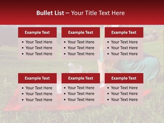 A Woman Sitting On Top Of A Blanket On Top Of A Lush Green Field PowerPoint Template