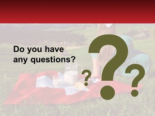 A Woman Sitting On Top Of A Blanket On Top Of A Lush Green Field PowerPoint Template