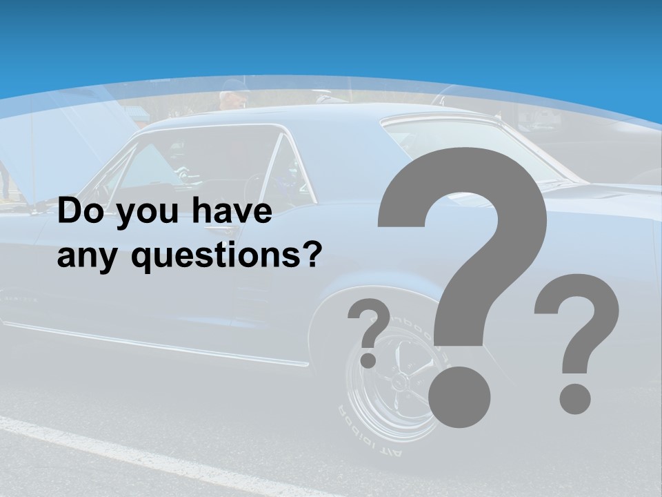 A Blue Car Is Parked In A Parking Lot PowerPoint Template