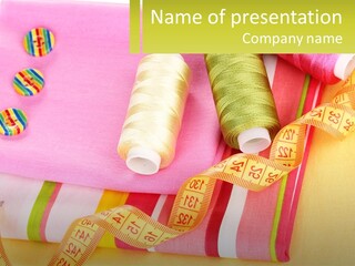 A Group Of Different Colored Spools Of Thread Next To Each Other PowerPoint Template