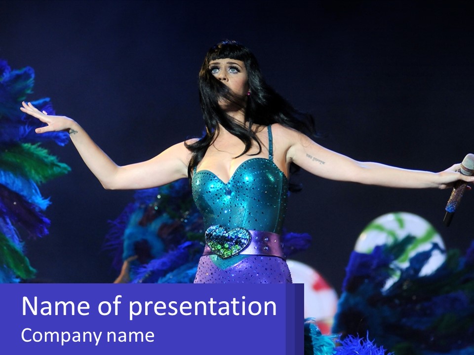 A Woman Dressed In A Blue And Green Costume PowerPoint Template