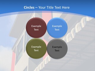 A Building With A Blue Sky In The Background PowerPoint Template