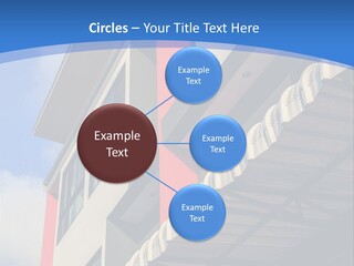 A Building With A Blue Sky In The Background PowerPoint Template