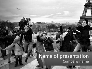 A Group Of People Standing In Front Of The Eiffel Tower PowerPoint Template