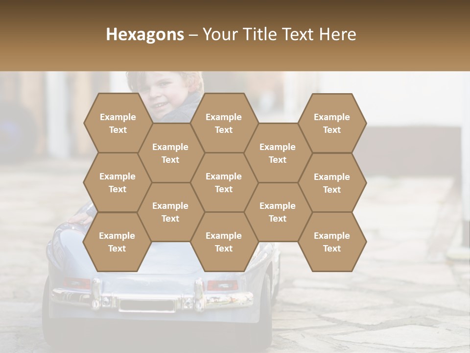 A Young Boy Is Sitting In A Toy Car PowerPoint Template