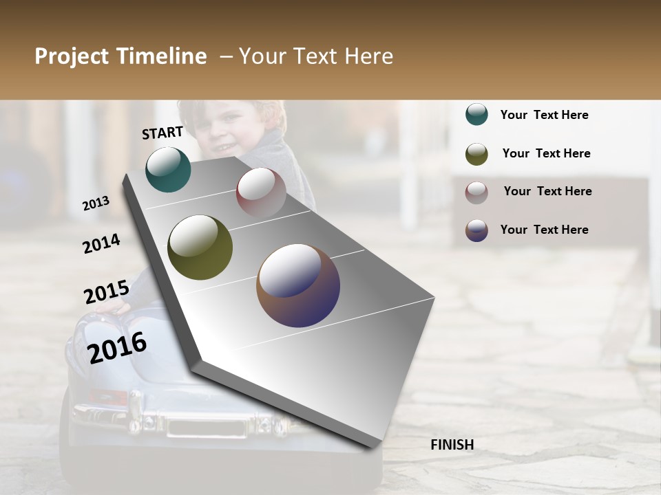 A Young Boy Is Sitting In A Toy Car PowerPoint Template