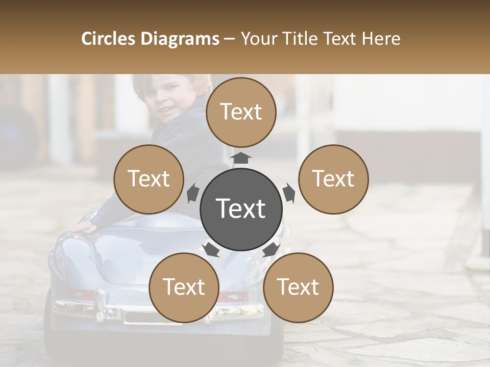 A Young Boy Is Sitting In A Toy Car PowerPoint Template