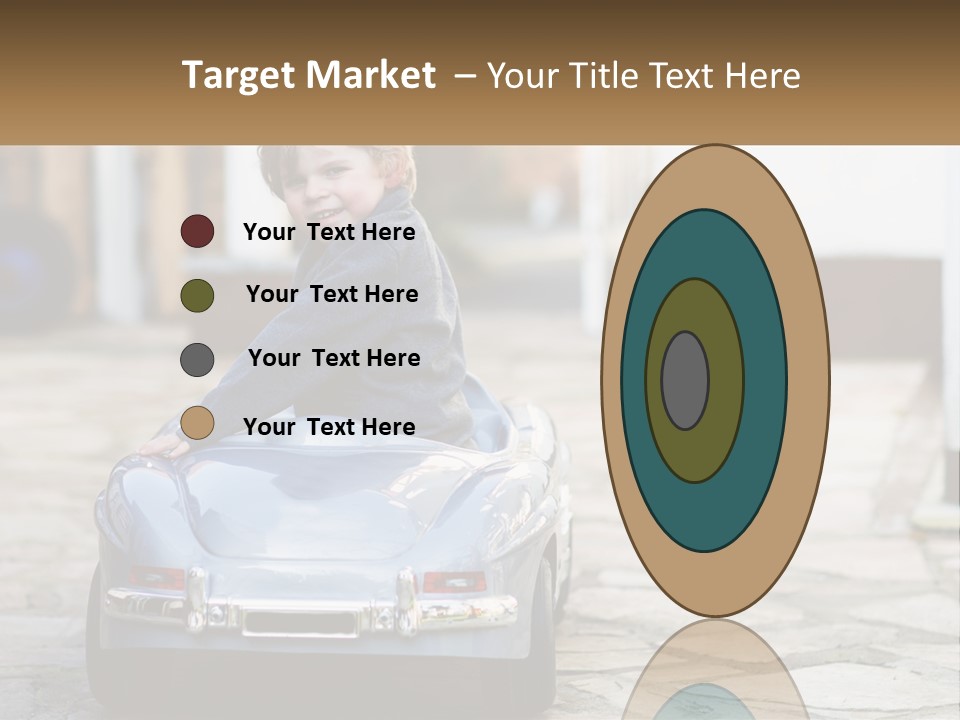 A Young Boy Is Sitting In A Toy Car PowerPoint Template