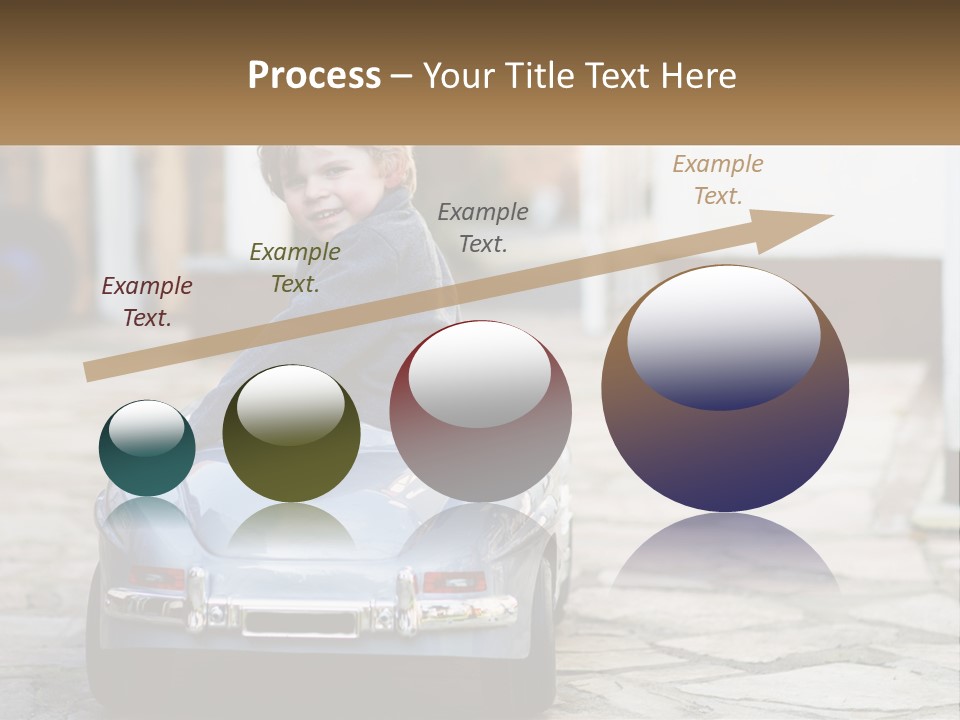 A Young Boy Is Sitting In A Toy Car PowerPoint Template