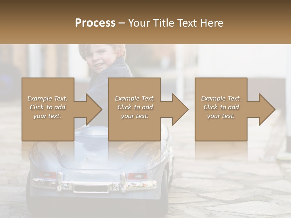 A Young Boy Is Sitting In A Toy Car PowerPoint Template