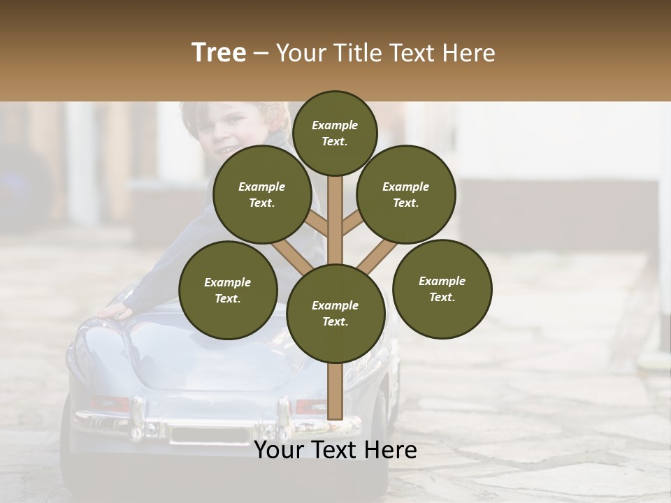 A Young Boy Is Sitting In A Toy Car PowerPoint Template