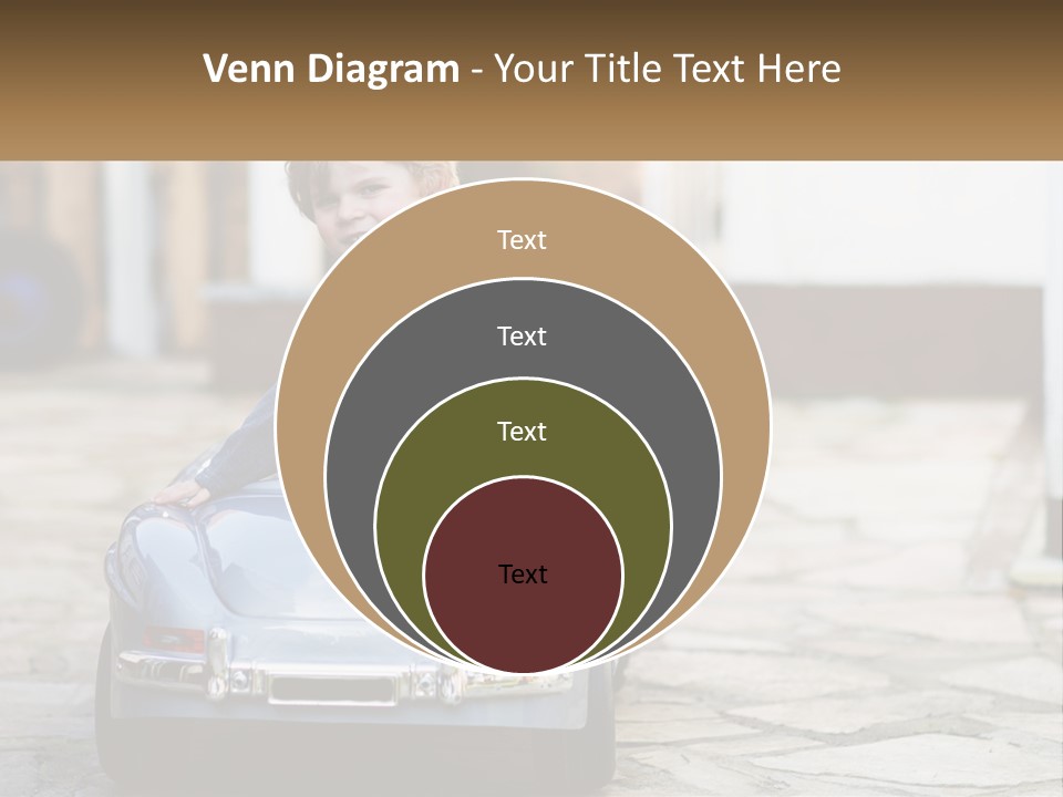 A Young Boy Is Sitting In A Toy Car PowerPoint Template