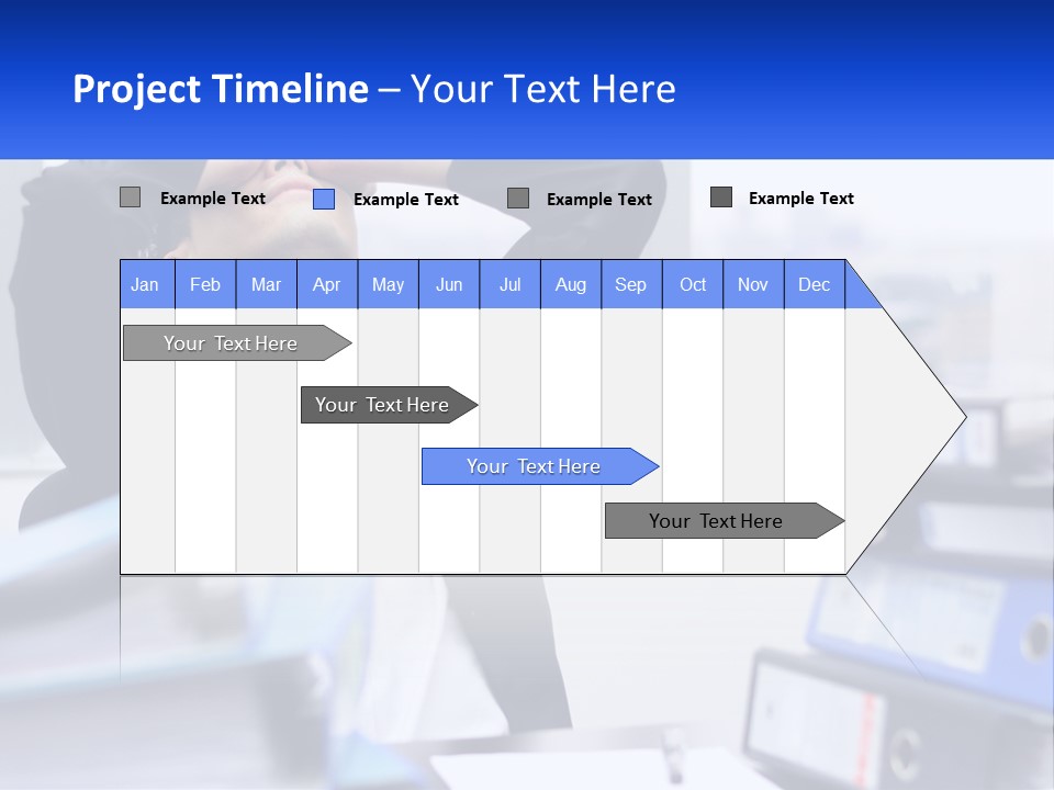 A Man Sitting At A Desk With His Head In His Hands PowerPoint Template