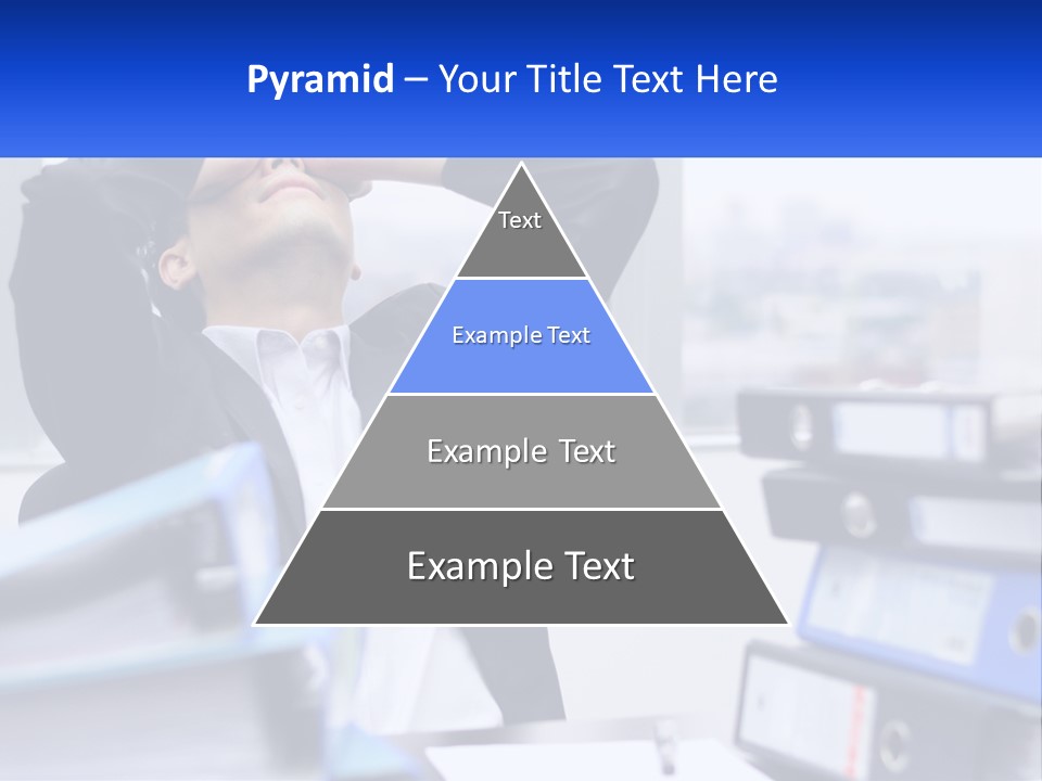 A Man Sitting At A Desk With His Head In His Hands PowerPoint Template