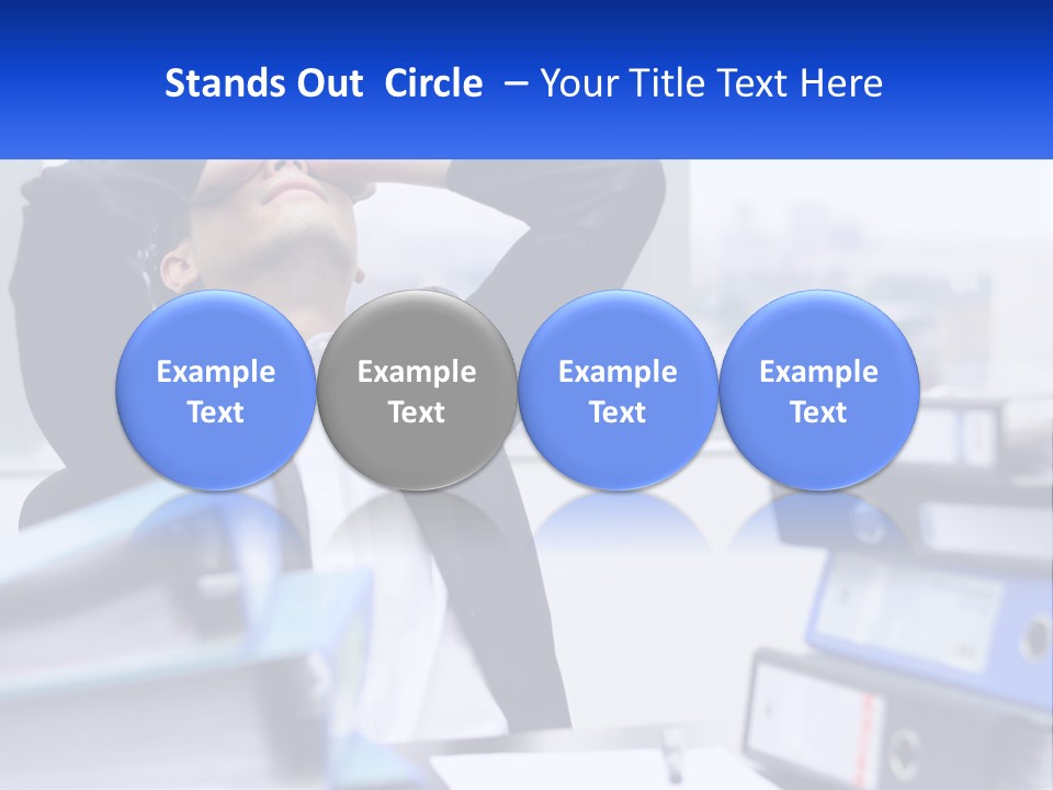 A Man Sitting At A Desk With His Head In His Hands PowerPoint Template