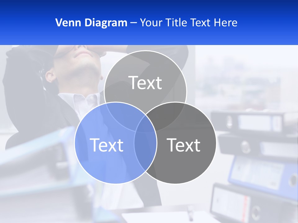 A Man Sitting At A Desk With His Head In His Hands PowerPoint Template